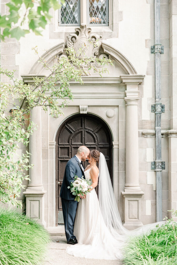 Bride and Groom in front of a church door, a Dream Wedding in Chicago.