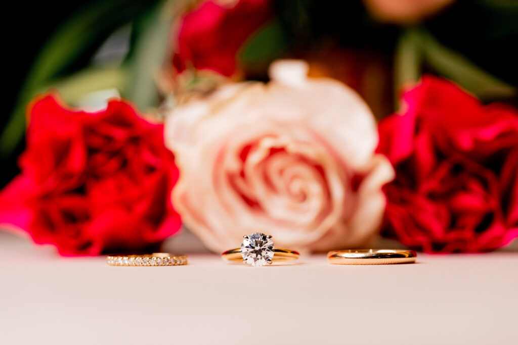 a picture of a wedding ring and engagement rings