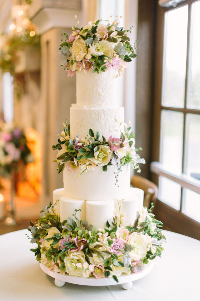 Three layered white wedding cake