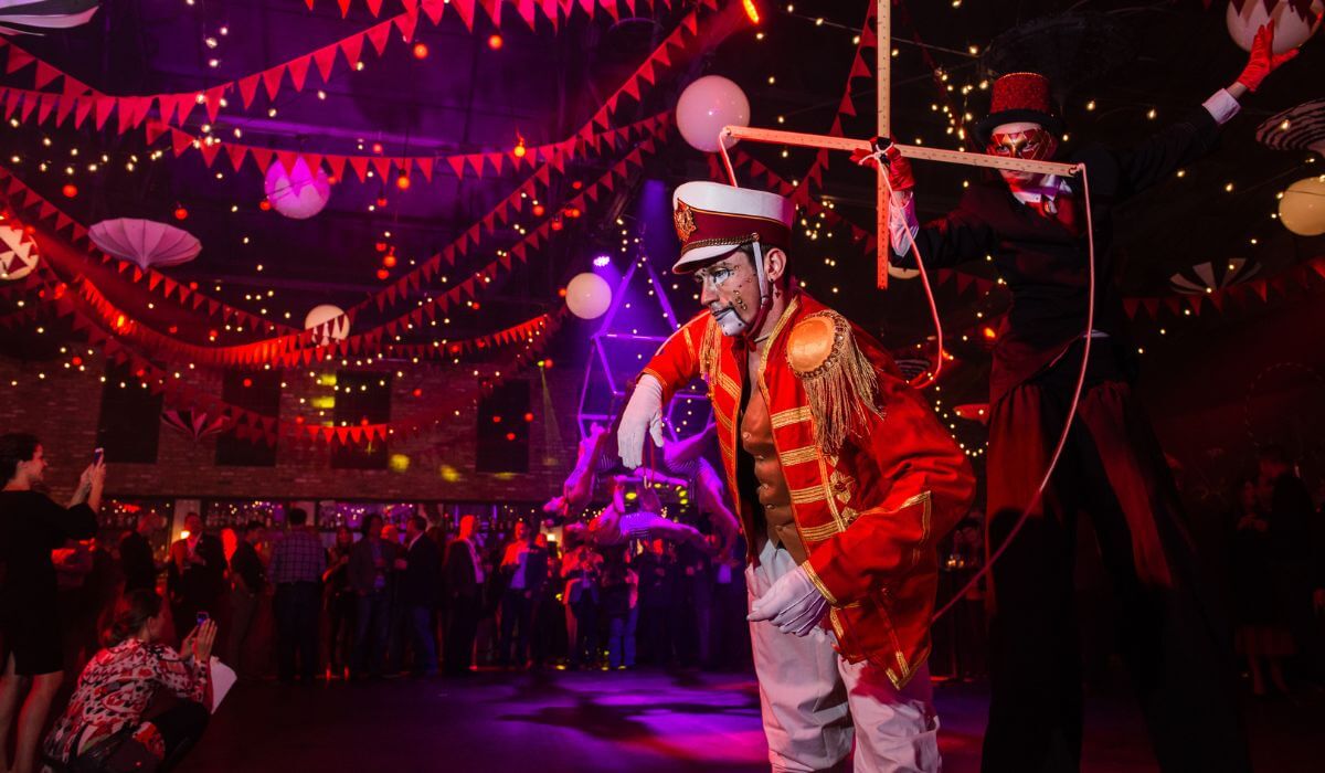 Exhilarating circus-themed event featuring a ringmaster and stilt walker, orchestrated by leading Event Planning Solution experts.