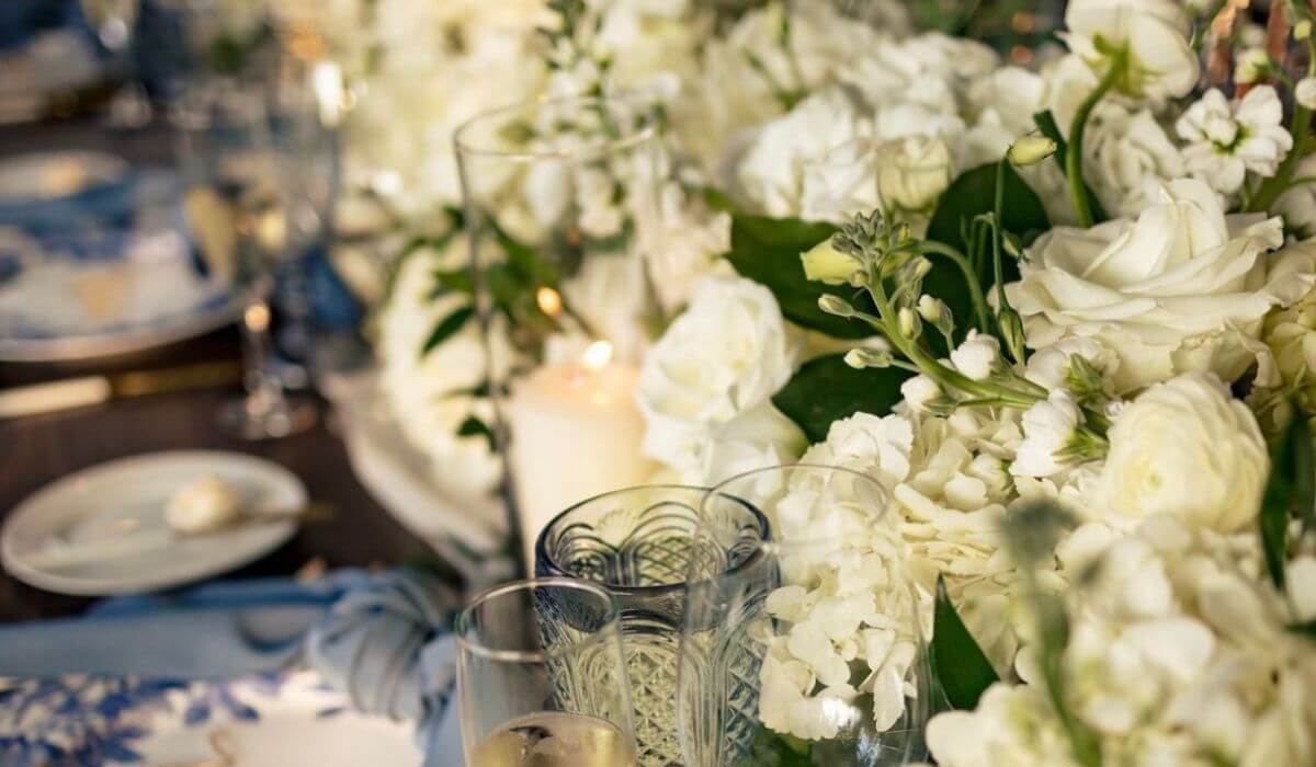 Luxurious white floral table arrangement at a wedding planned by Chicago's Finest Planners.