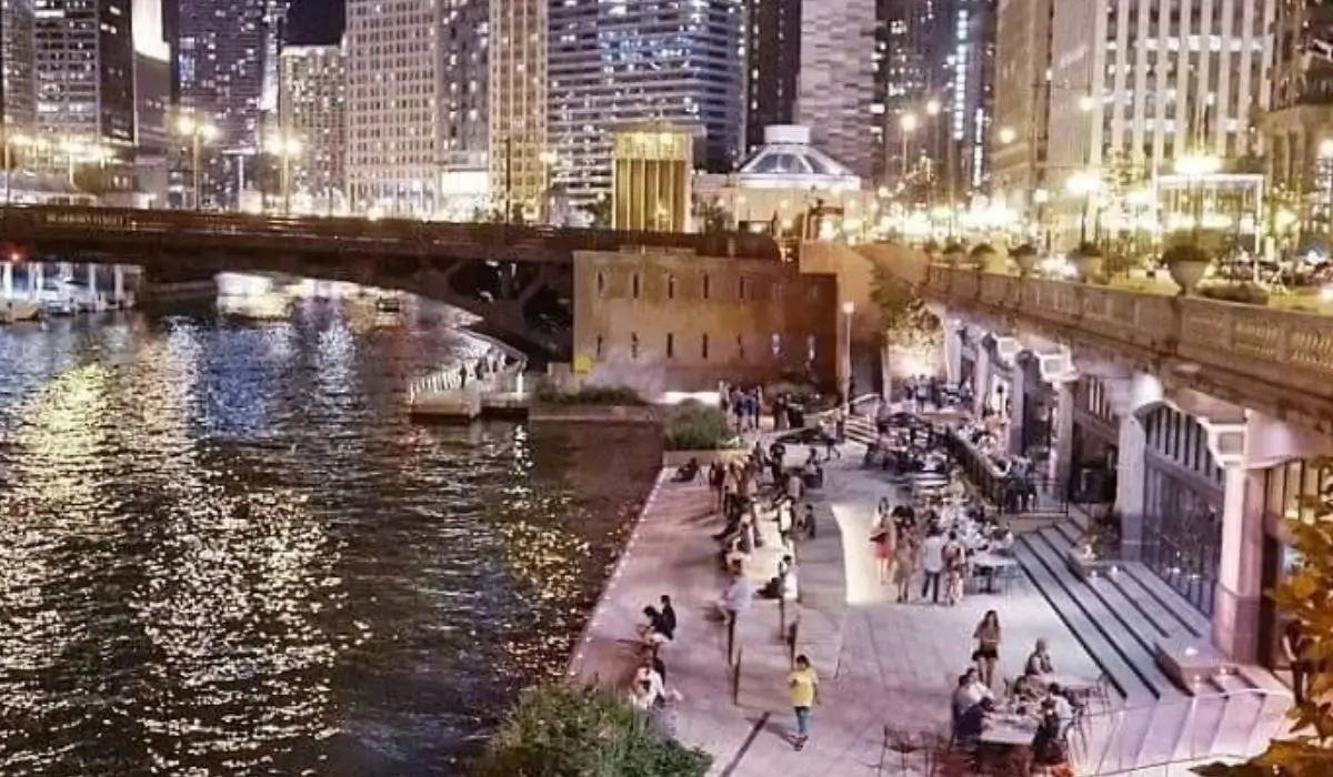 Evening view of the Chicago Riverwalk, a romantic spot for a winter proposal with city lights reflecting on the water.