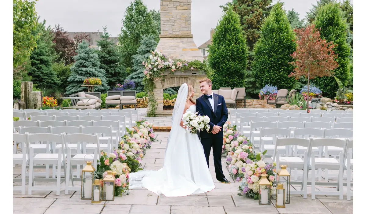 Bride and groom at an outdoor ceremony, showcasing beautiful floral arrangements and expert wedding planning in Chicago.