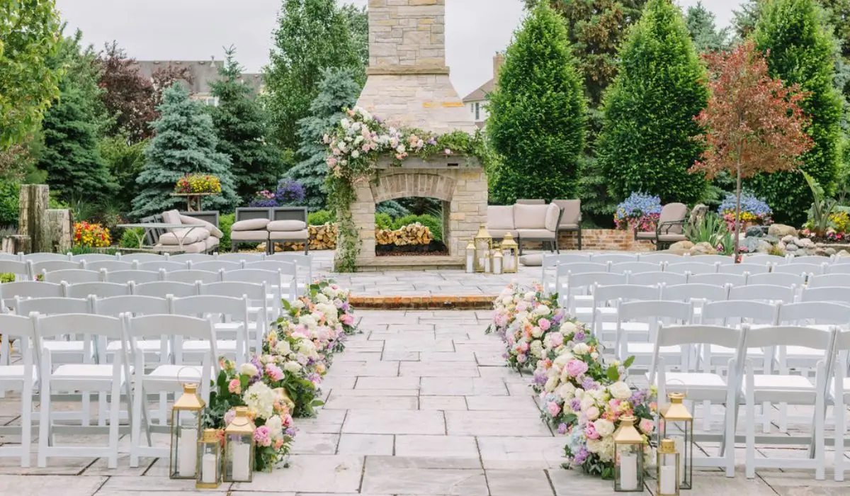 A picturesque outdoor setup at a Chicago wedding venue featuring floral arrangements, lanterns, and elegant seating.