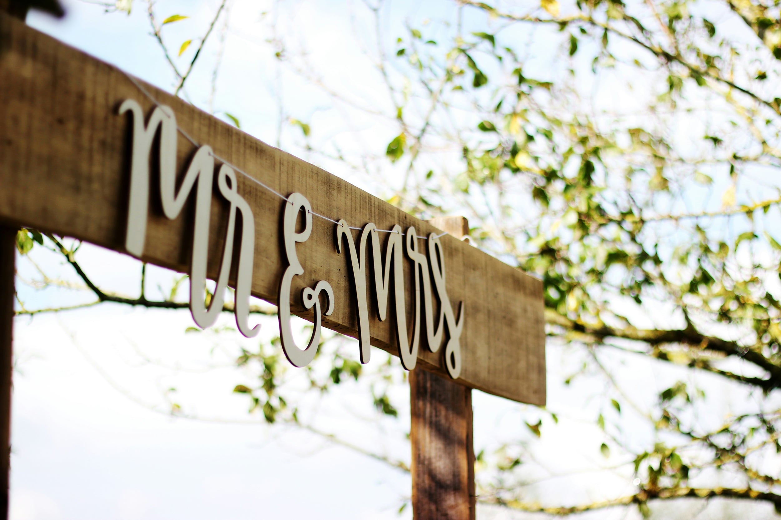 a wodden wedding signage that says mr & mrs