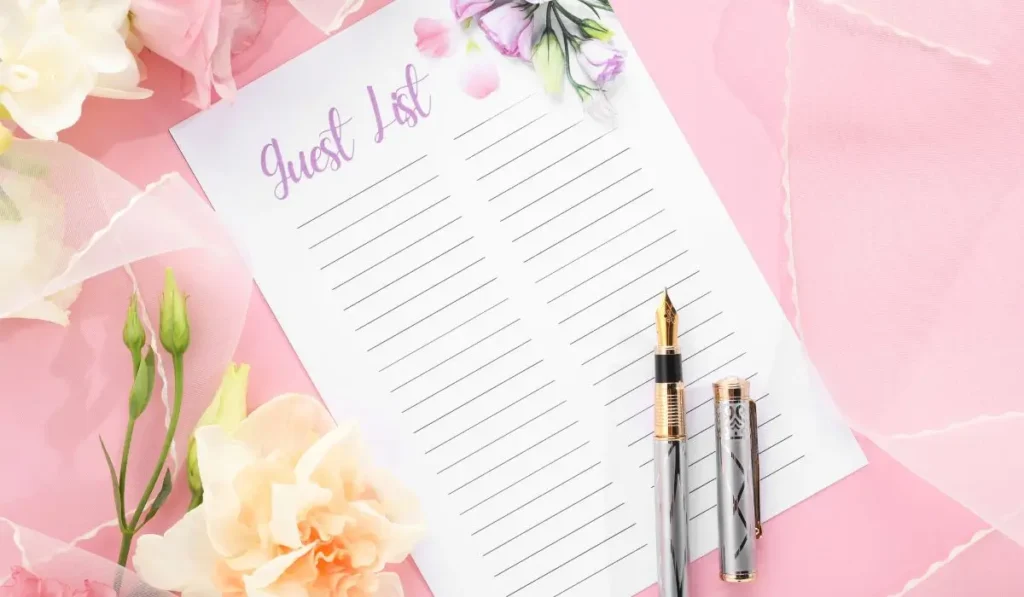 Beautiful wedding guest list template and pen with floral decorations, designed to support professional wedding planner tasks.