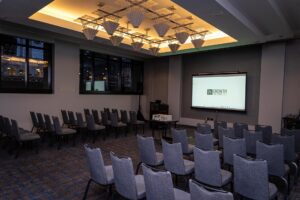 Breakout room setup for the Chicago Financial Growth Conference, featuring organized seating and a professional environment for executive meetings and presentations.