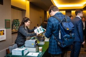 Conference check‑in table prepared for the Chicago Financial Growth Conference, featuring organized materials and a seamless guest arrival setup.