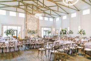 Reception space in the main ballroom at The Farmhouse in Plainfield, showcasing elegant décor and refined details from this Elegant Farmhouse Wedding.