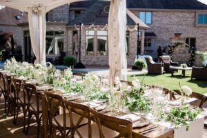 Reception space under a beautifully lit tent at an Outdoor Micro Wedding at a Private Residence, showcasing elegant design and an intimate at‑home celebration.