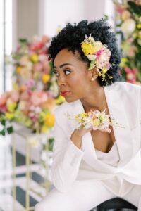 Bride wearing a sculptural floral ring in place of a traditional bouquet, showcasing a modern and artistic detail at this inclusive luxury Chicago wedding.