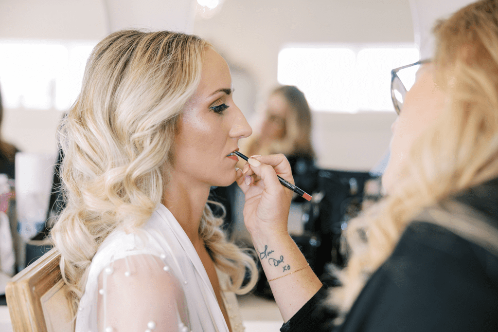 Bride finalizing her hair and makeup look during the beauty trial stage of the Chicago wedding planning timeline.
