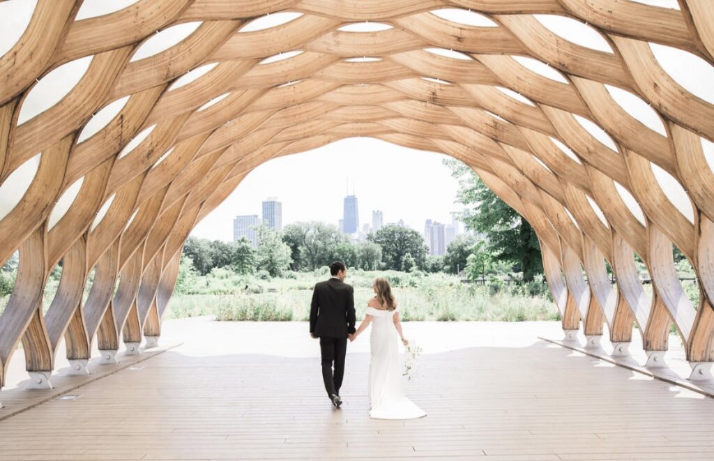 Bride and groom standing under the Honeycomb in Chicago known as one of the best Chicago wedding venues