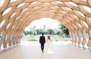 Bride and groom standing under the Honeycomb in Chicago known as one of the best Chicago wedding venues