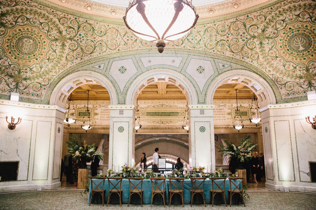 Elegant Chicago Cultural Center weddings featuring teal tablescape, mosaic arches, and historic architectural details.