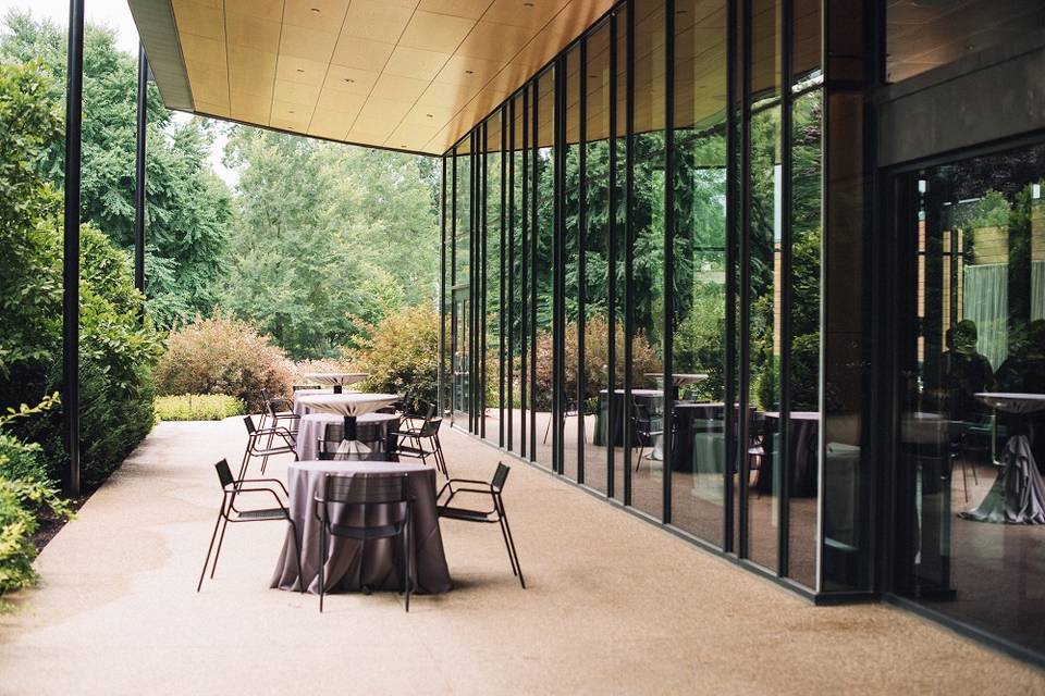 Sycamore room terrace at Morton Arboretum styled for cocktail hour with garden views and modern patio design