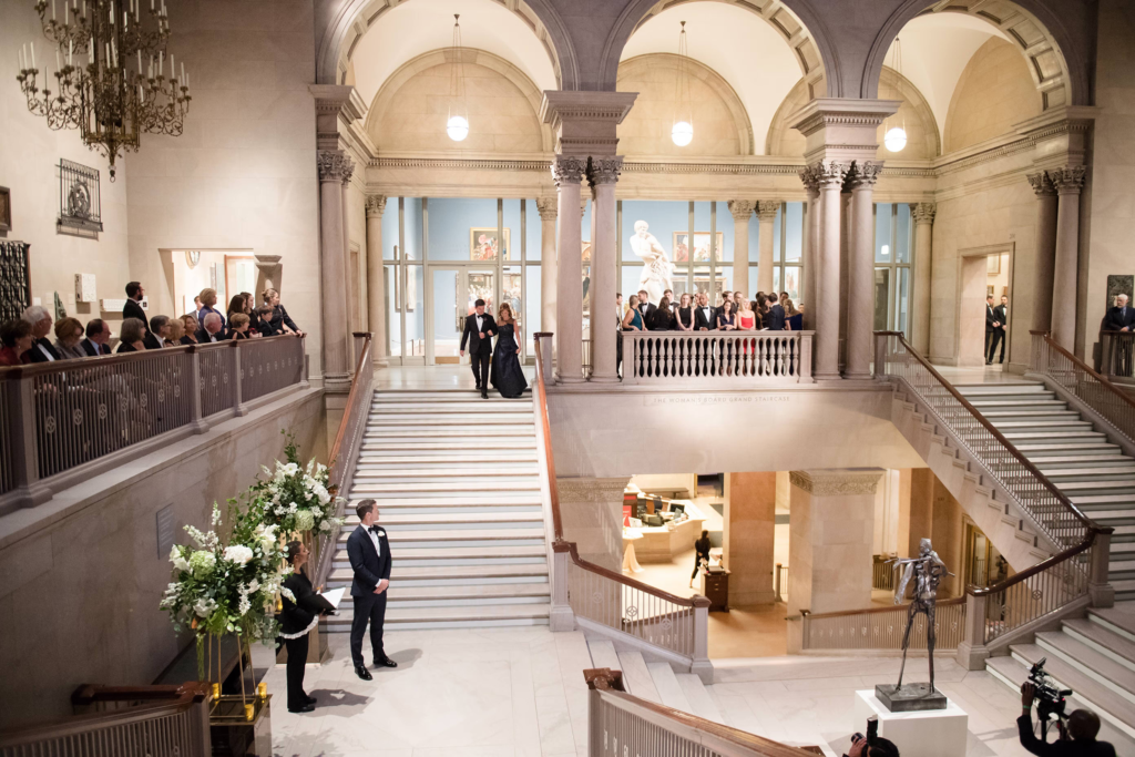Elegant wedding ceremony setup at the Woman’s Board Grand Staircase inside the Art Institute of Chicago.