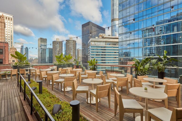 Château Carbide rooftop terrace at Pendry Chicago featuring modern lounge seating and sweeping views of the downtown Chicago skyline.