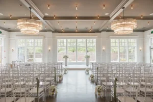 Elegant Naperville wedding ceremony with white florals, gold accents, and natural light for timeless celebrations.
