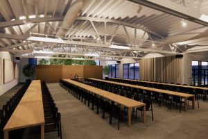 Modern Chicago conference hall with vaulted ceiling, natural light, and long tables for collaborative events.