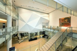 Contemporary Chicago cultural venue with geometric architecture, glass railings, and museum-style displays for modern events.