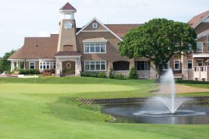 Elegant clubhouse and fountain at a luxury Chicago golf course — ideal for weddings and retreats.