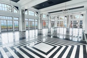 Elegant Chicago event venue with geometric flooring, arched windows, and waterfront views for weddings and galas.