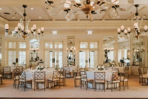 Elegant banquet hall set for a formal Chicago wedding or corporate dinner, with chandeliers and floral centerpieces.